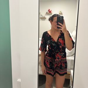 Floral romper in new condition.